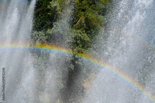 One rainbow in the water of fountain