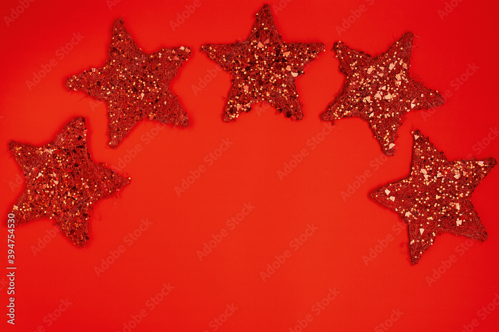 flat lay with star shaped christmas toys on red background flat lay with star shaped christmas toys on red background