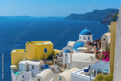 A view along the edge of the village of Oia, Santorini towards the caldera in summertime