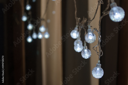 Selective focus of Christmas lights bulbs.