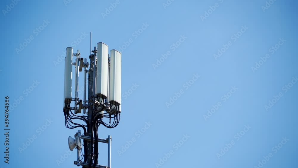Signal or mobile phone tower against blue sky. Radio antenna. Modern telecommunication by using 5g or 4g internet. Signal or mobile phone tower against blue sky. Radio antenna. Modern telecommunication by using 5g or 4g internet.