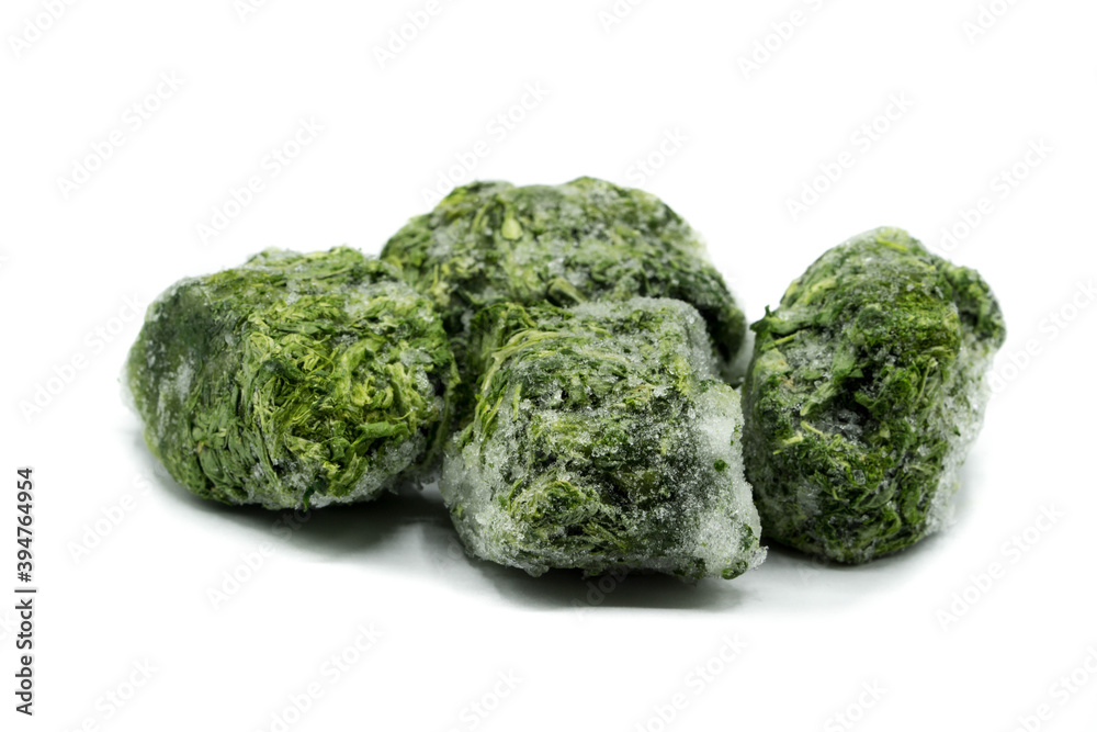 frozen spinach isolated on white background frozen spinach isolated on white background