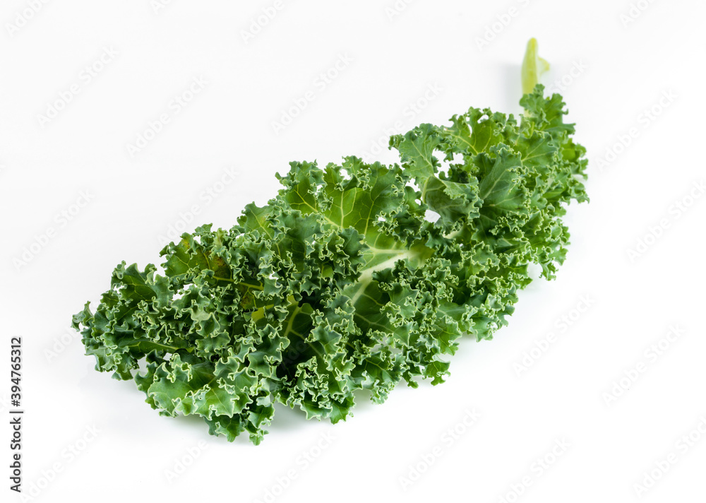 Kale leaf salad vegetable isolated on white background. Creative layout made of kale closeup. Kale leaf salad vegetable isolated on white background. Creative layout made of kale closeup.