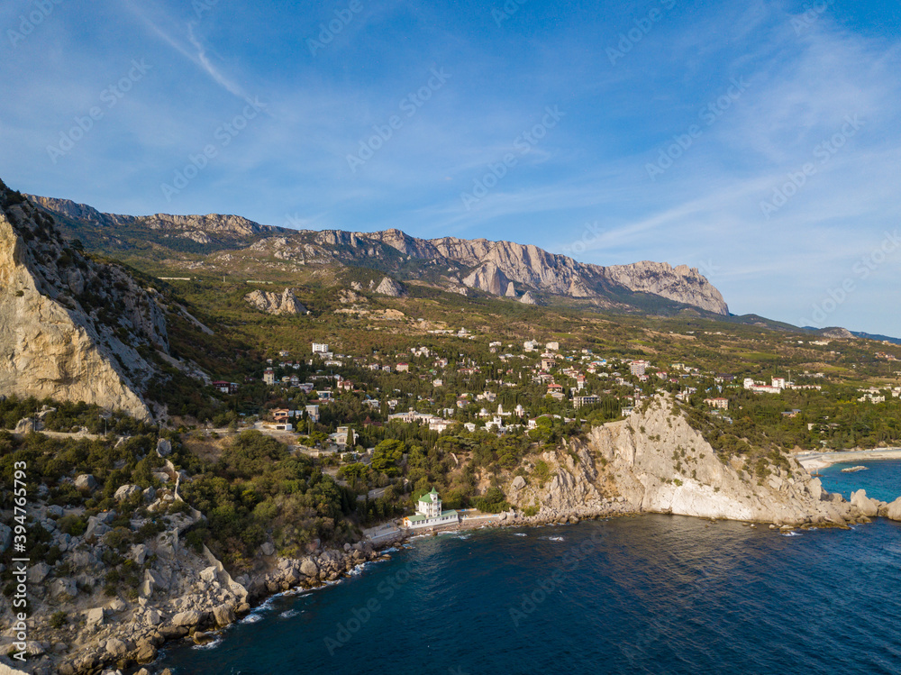 Aerial view to sea shore with buidings and mountains near Simeiz village, Crimea