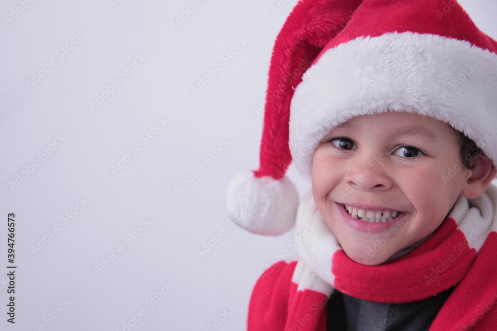 little boy with Christmas hat on his head with white background stock photo little boy with Christmas hat on his head with white background stock photo