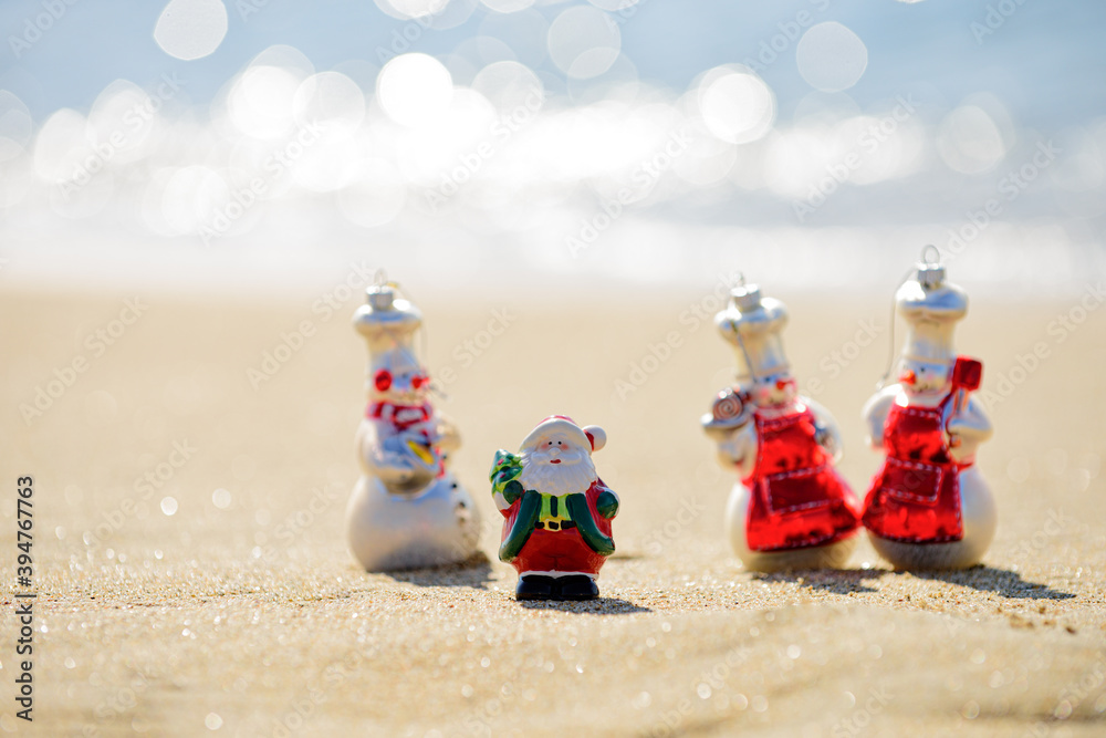 Fototapeta premium Summer Santa Claus. New Year concept for travel destinations in hot tourist countries.