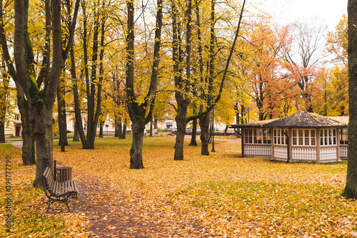 autumn in the city park with a restaurant type building