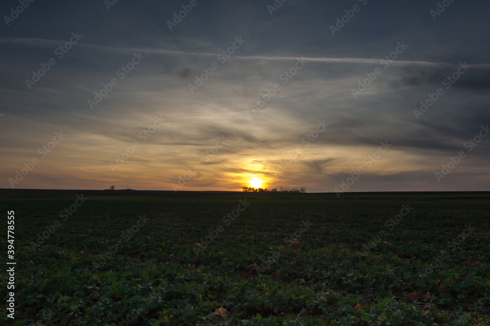 Autumn sunset over farmland and