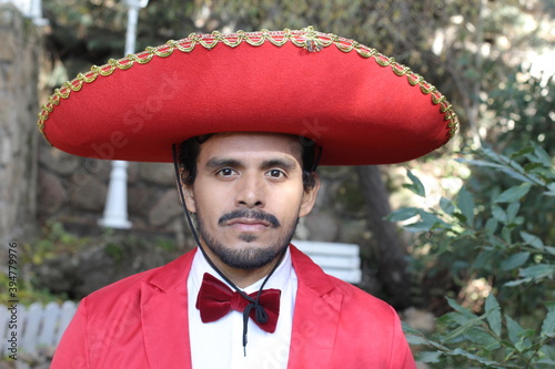 Handsome mariachi with red outfit  photo