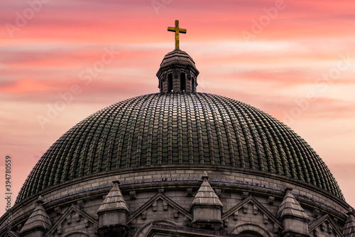 Cathedral Basilica of Saint Louis dome shot at sunset with bright colors.