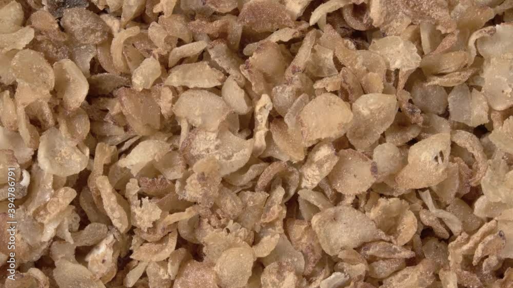 Rotation of buckwheat flakes close-up. Instant buckwheat. Rotation of buckwheat flakes close-up. Instant buckwheat.