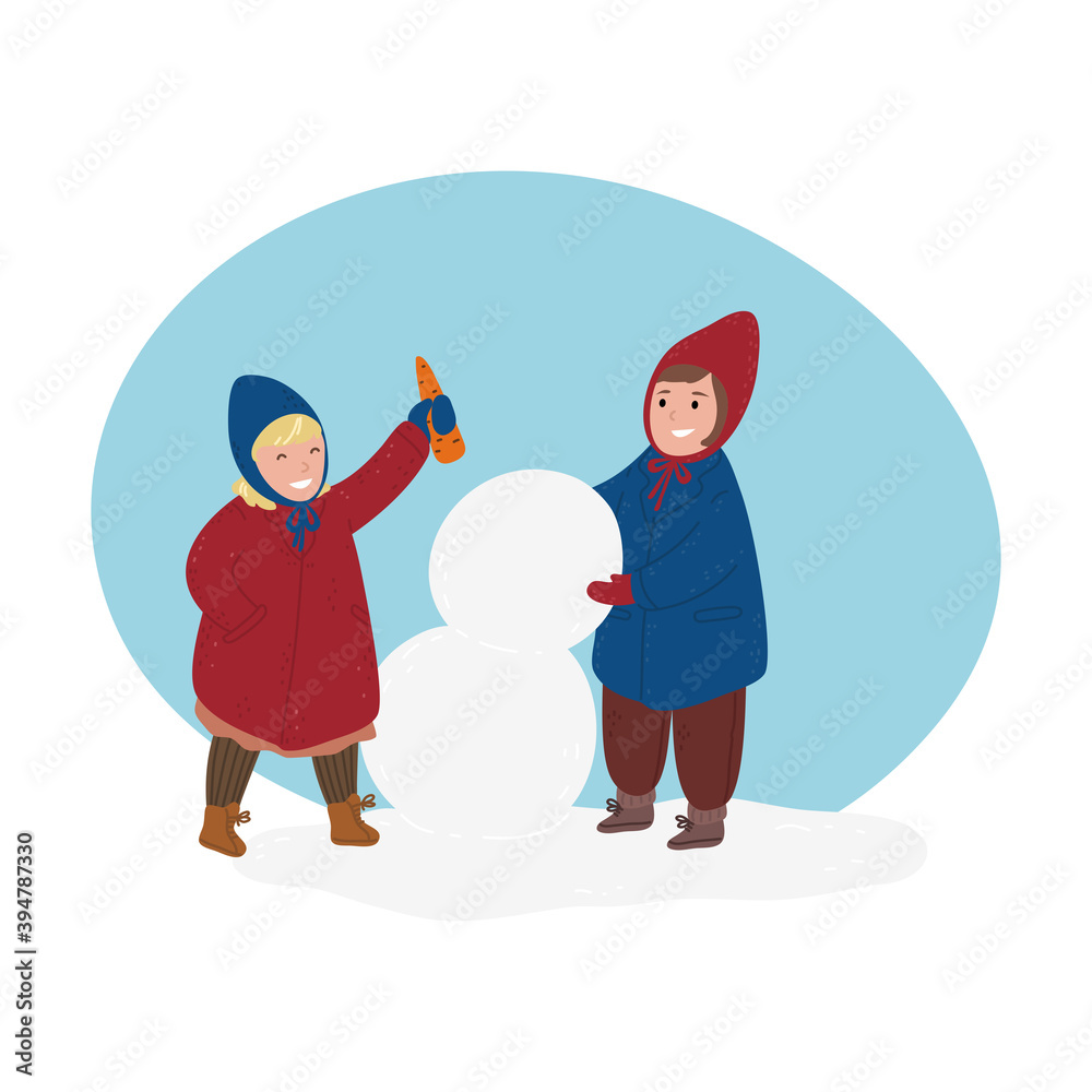 Children wearing comfortable cozy warm winter clothes making snowman Children wearing comfortable cozy warm winter clothes making snowman