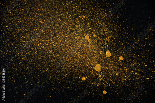 Golden drops on a black background.