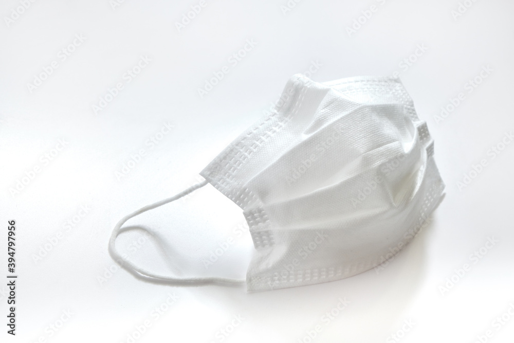 Medical mask on white background. Coronavirus protection. Hygiene and healthcare theme. Medical mask on white background. Coronavirus protection. Hygiene and healthcare theme.