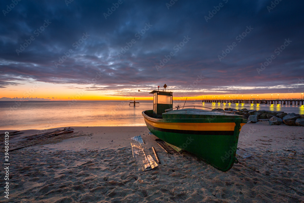 Fishing boat on the beach in Orlowo before sunrise, Gdynia. Poland Fishing boat on the beach in Orlowo before sunrise, Gdynia. Poland