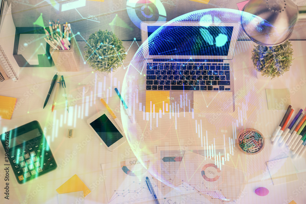 Double exposure of forex chart drawing over table background with computer. Concept of financial research and analysis. Top view. Double exposure of forex chart drawing over table background with computer. Concept of financial research and analysis. Top view.