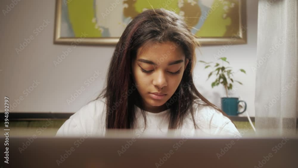 Young black woman using laptop for e-learning. Online corporate webcam meeting, virtual training, remote work communication Young black woman using laptop for e-learning. Online corporate webcam meeting, virtual training, remote work communication