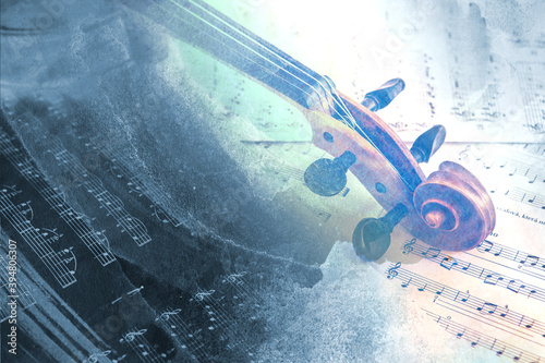 Old violin lying on the sheet of music, abstract watercolor concept