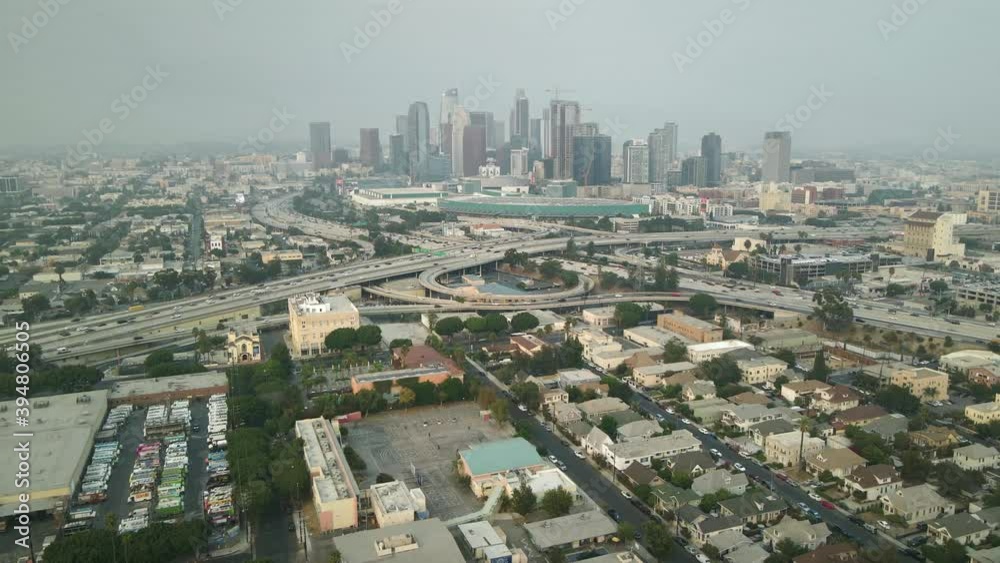 Aerial downtown Los Angeles. Slow motion drone shot. Cars traffic on freeway roads in center LA. Modern business offices & apartments. American urban life. Aerial downtown Los Angeles. Slow motion drone shot. Cars traffic on freeway roads in center LA. Modern business offices & apartments. American urban life.