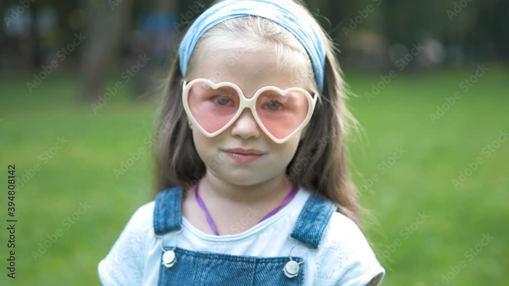 Portrait of happy cute child girl in summer outdoors. Portrait of happy cute child girl in summer outdoors.