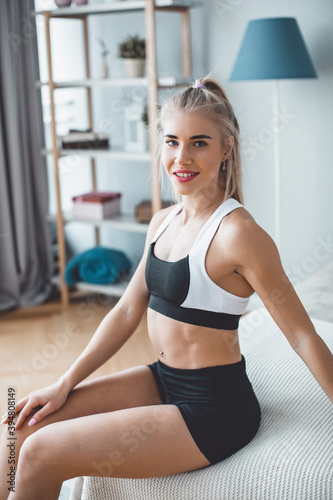 Portrait smiling  fitness woman at home © BestForYou