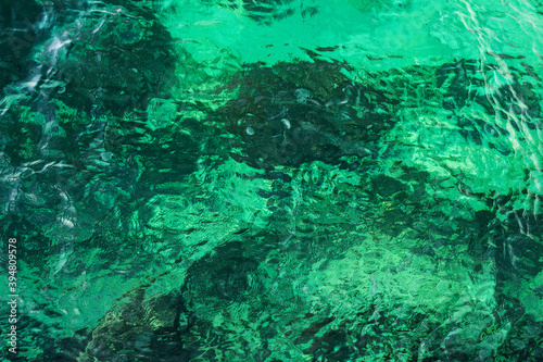 Clear turquoise rippled seawater full-screen texture, top view