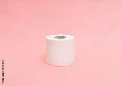 Toilet paper roll Photo in minimal style with copy space One clean soft toilet paper roll on light pink backdrop