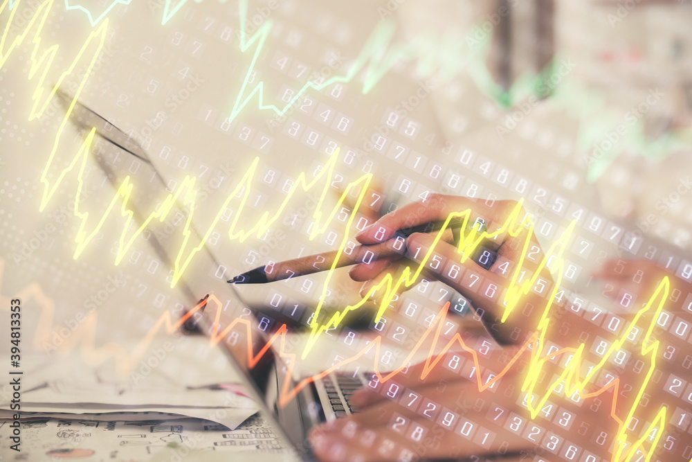 Multi exposure of woman hands typing on computer and financial graph hologram drawing. Stock market analysis concept.