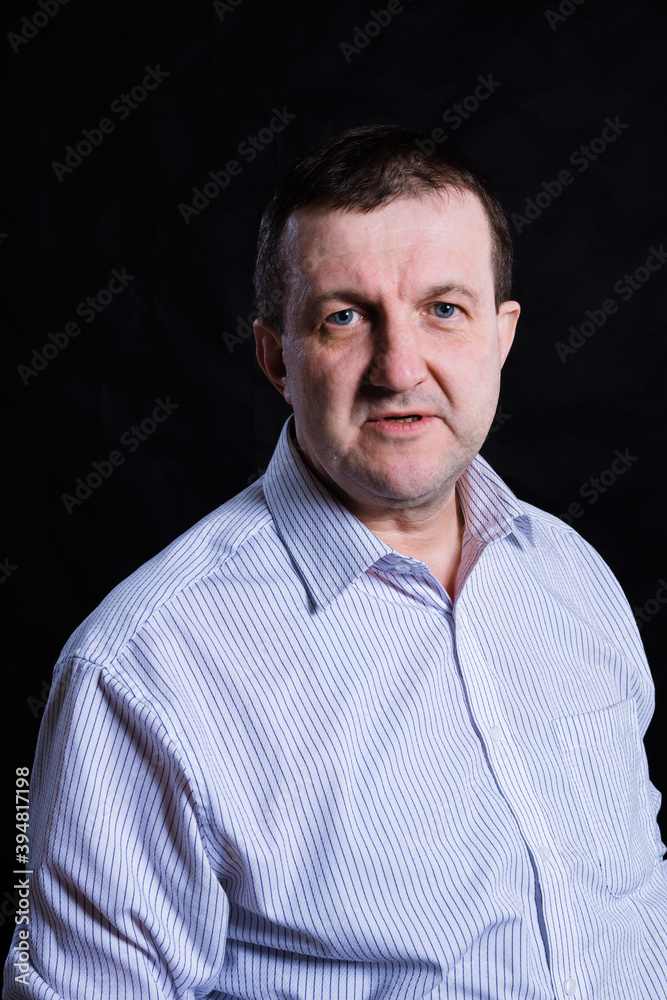 Fototapeta premium Middle aged solid man dressed in shirt studio portrait
