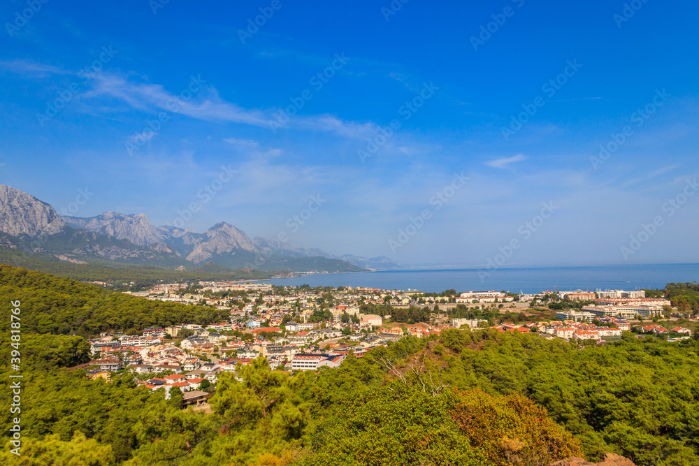 View of Kemer town on a coast of the Mediterranean sea in Antalya province, Turkey. Turkish Riviera. View from a mountain