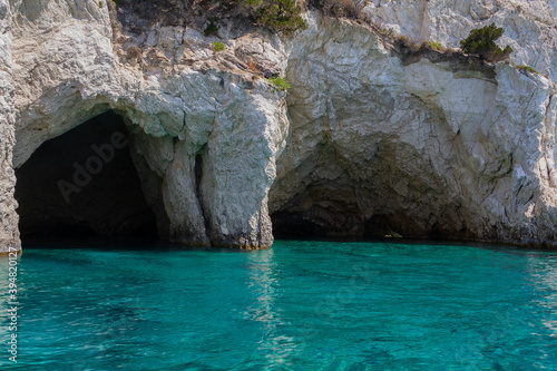 Seascape - picturesque caves in the coastal cliffs and blue water
