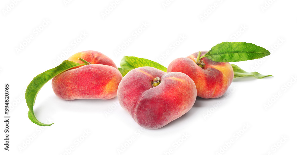 Fresh donut peaches with leaves on white background