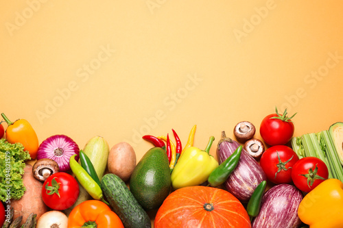 Fototapeta Naklejka Na Ścianę i Meble -  Flat lay composition with fresh vegetables on yellow background. Space for text