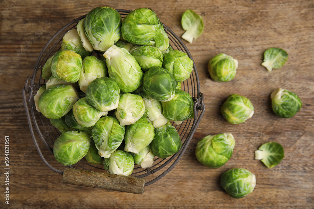 Fresh Brussels sprouts on wooden table, flat lay Fresh Brussels sprouts on wooden table, flat lay