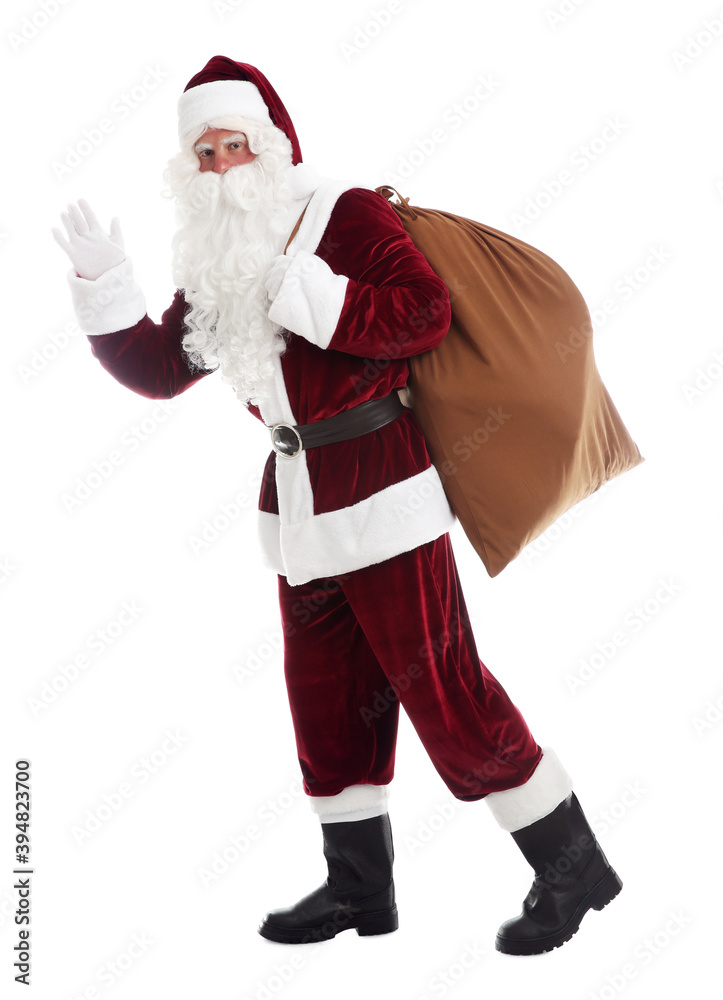 Santa Claus with sack walking on white background Santa Claus with sack walking on white background