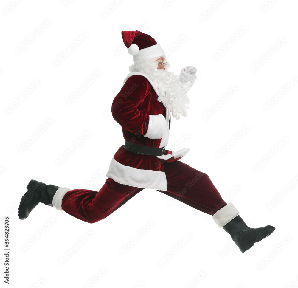 Santa Claus in red costume jumping on white background Santa Claus in red costume jumping on white background