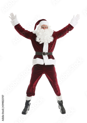 Santa Claus in red costume jumping on white background