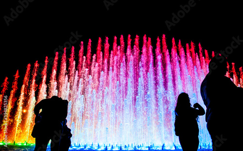 Tourists at Rainbow Fountain at the Magic Water Circuit (world's largest fountain complex), Park of the Reserve, Lima, Peru.