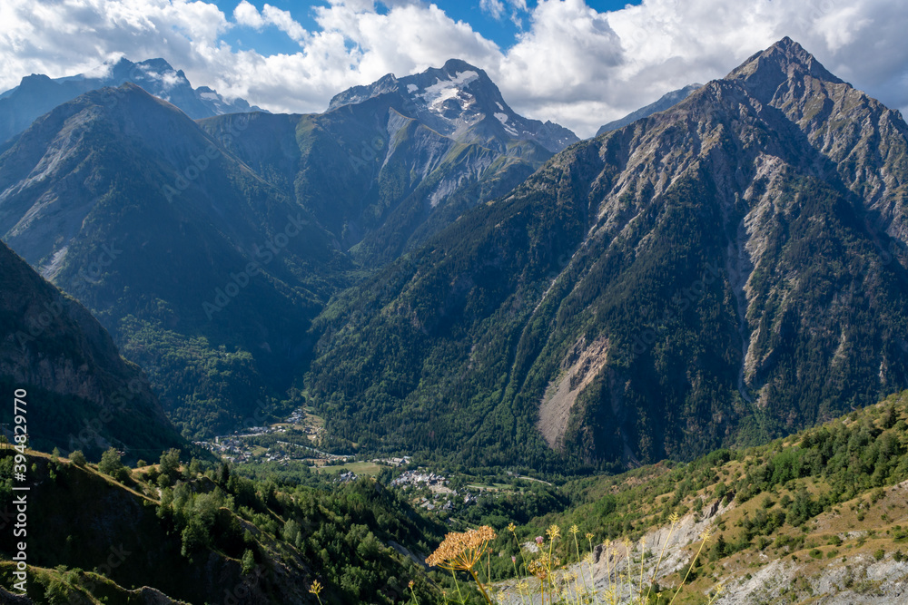 Fototapeta premium Hiking near ski station Les deux Alpes and view on Alpine mountains peaks in summer, Isere, France