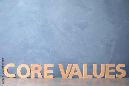 Phrase CORE VALUES made of wooden letters on light table