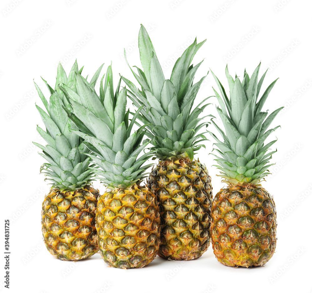 Fresh ripe juicy pineapples isolated on white Fresh ripe juicy pineapples isolated on white