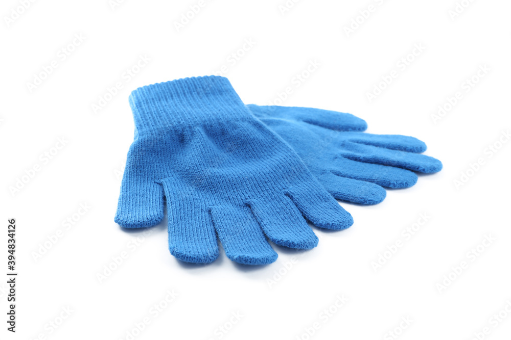 Blue woolen gloves on white background. Winter clothes Blue woolen gloves on white background. Winter clothes