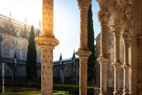 pillars of the arches in the cloister of Batalha monastery with sunlight - Batalha Portugal. photo