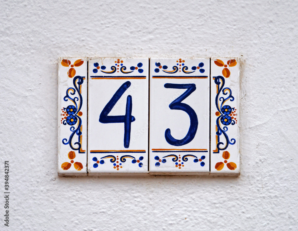 Fototapeta premium Street sign number 43 on a white wall 
