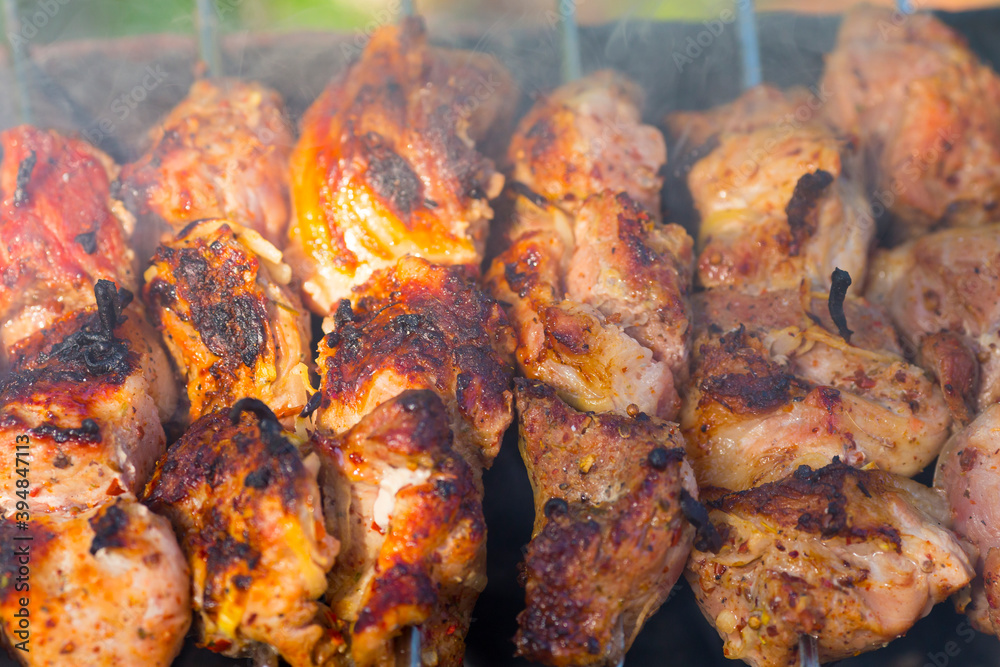 Close up view of roasted meat prepairing on barbeque. Close up view of roasted meat prepairing on barbeque.