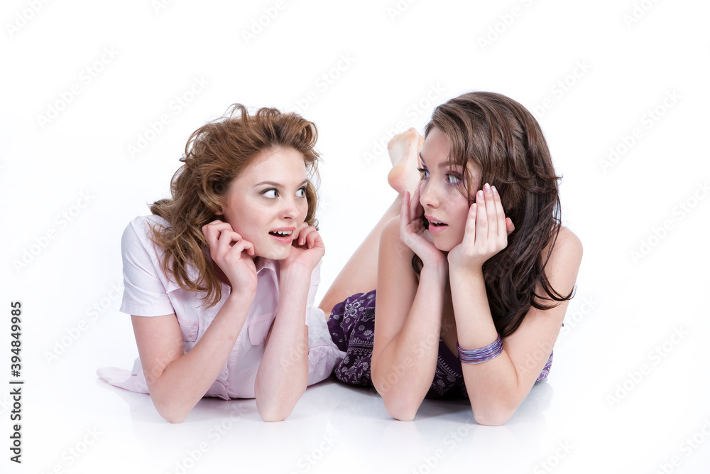 Two young women on isolated background Two young women on isolated background