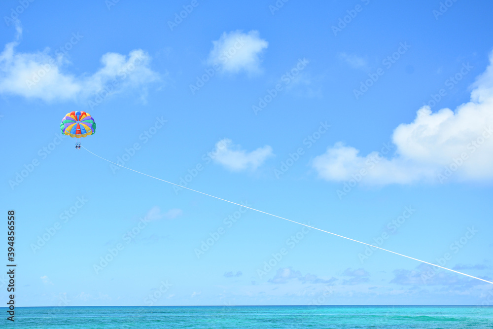 Parasailing with clear blue skies in the Bahamas near Nassau in the Caribbean Parasailing with clear blue skies in the Bahamas near Nassau in the Caribbean