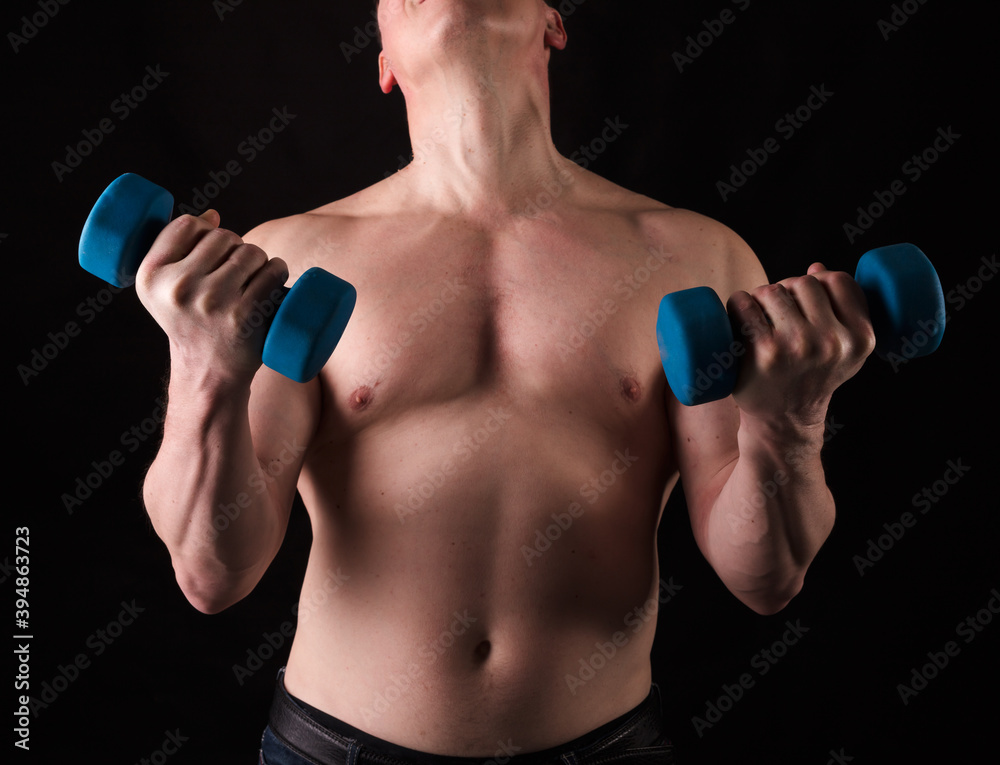 Matured man with naked muscular torso making exercises Matured man with naked muscular torso making exercises