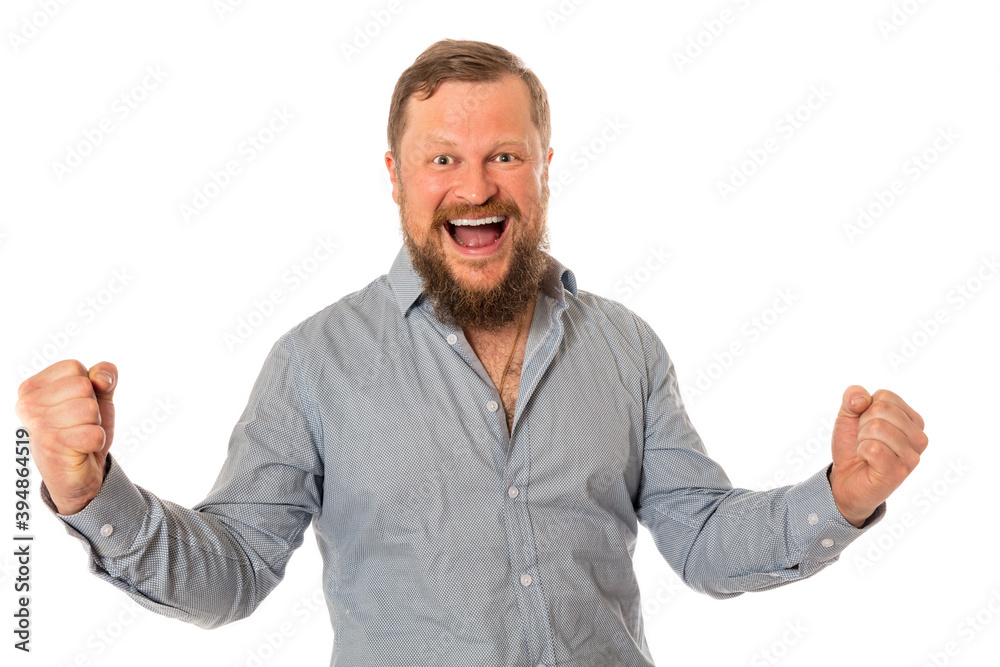 Joyful bearded man in shirt is happy to win