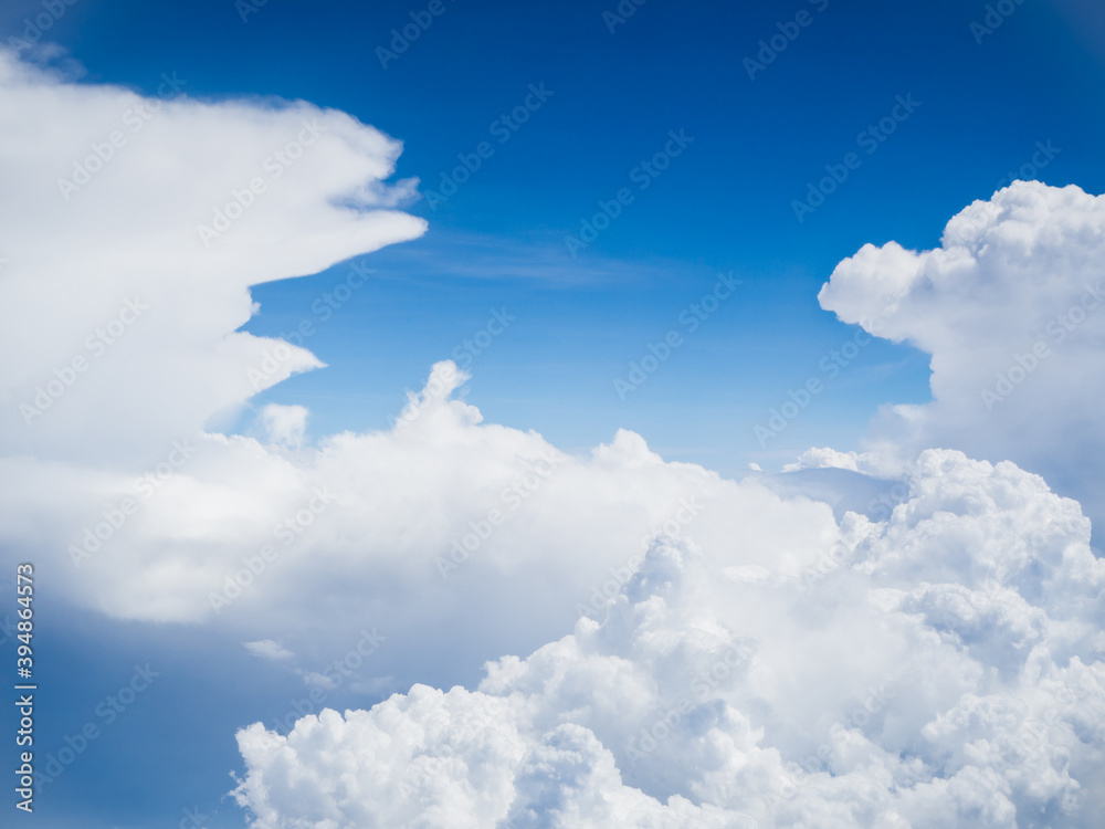 View of blue sky background with white cloud on high level